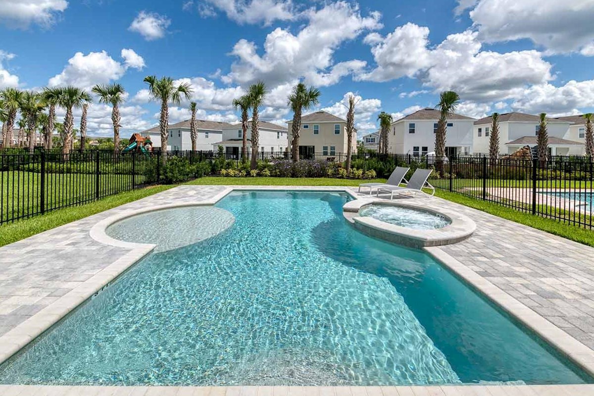 Huge south facing pool with hot tub